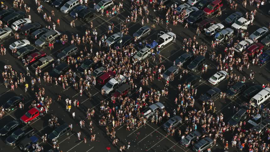 Aerial footage of a crowded parking lot near Campbells Field in Camden New Jersey during the summer