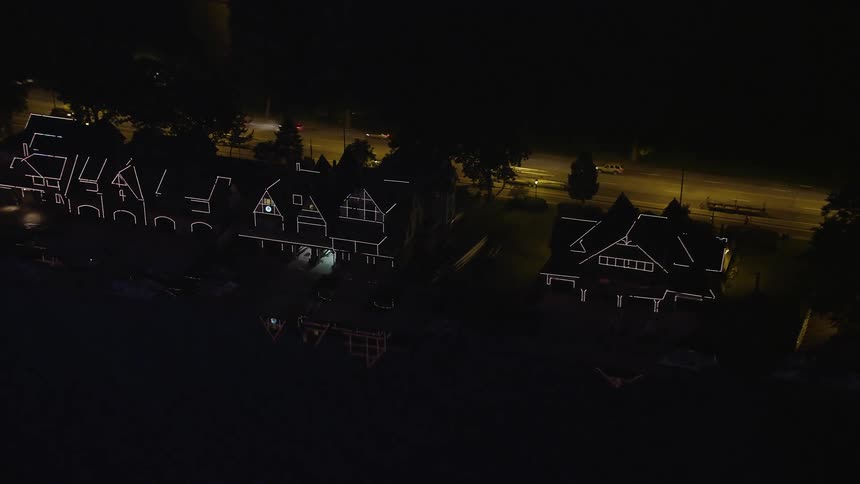 A aerial footage showcasing Boathouse Row illuminated at night in Philadelphia Pennsylvania