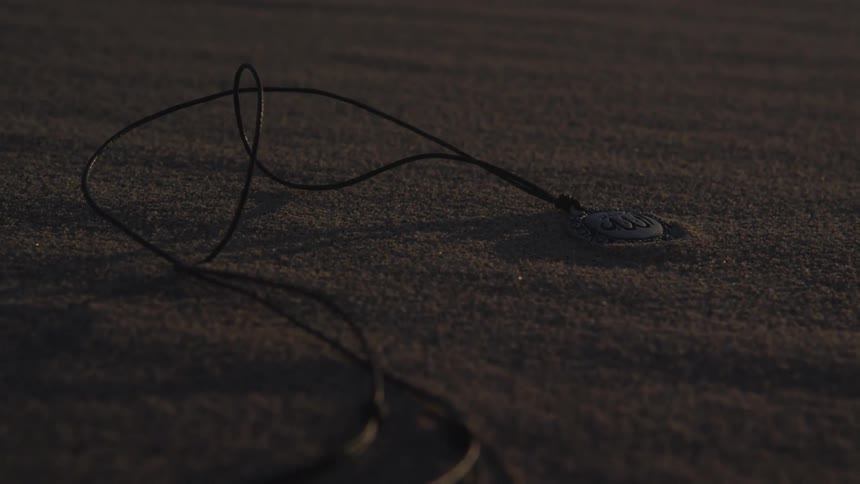 A necklace lying in the sand