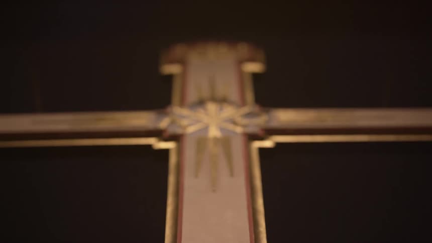Lights shines on a crucifix