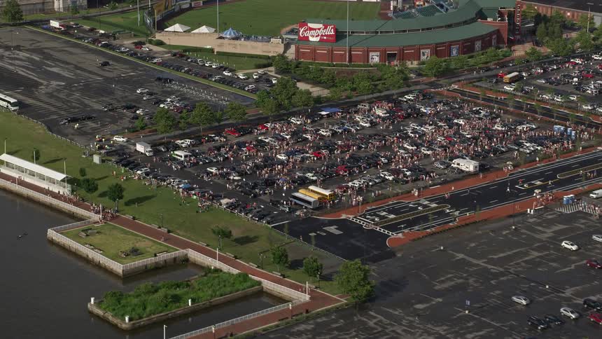 Aerial view of cars parked outside of a stadium