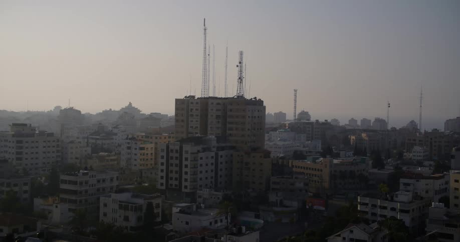 Aerial view of a city with fog is displayed