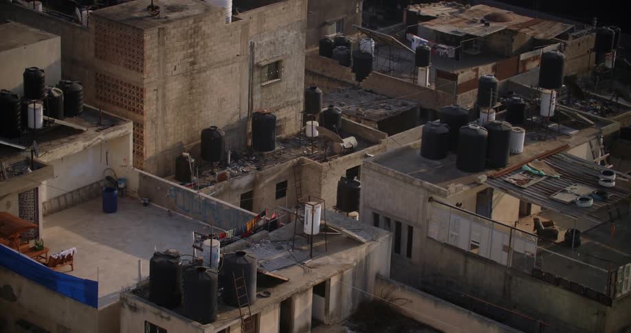 Building rooftops with water holding vessels as seen during the day