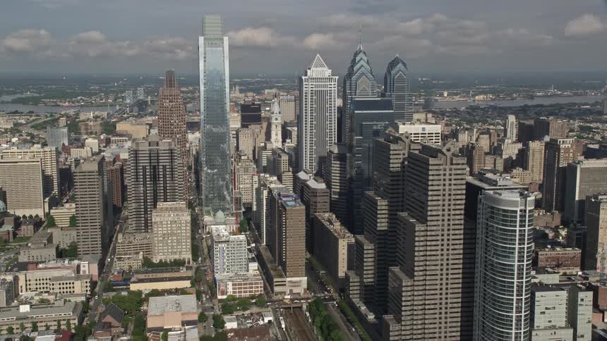 Aerial view of Downtown Philadelphia skyscrapers in partly cloudy daytime conditions