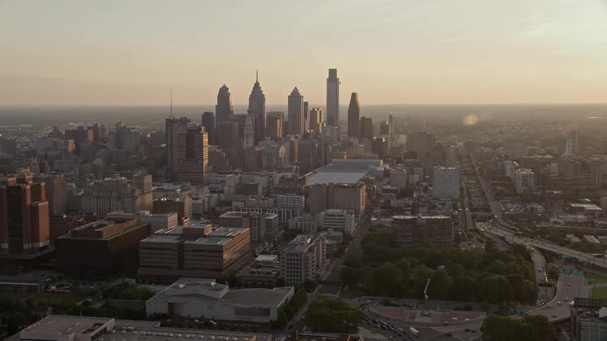 A stunning aerial view captures the beauty of Philadelphias downtown skyline at sunset with high-rise towers and skyscrapers towering over the bustling metropolis below