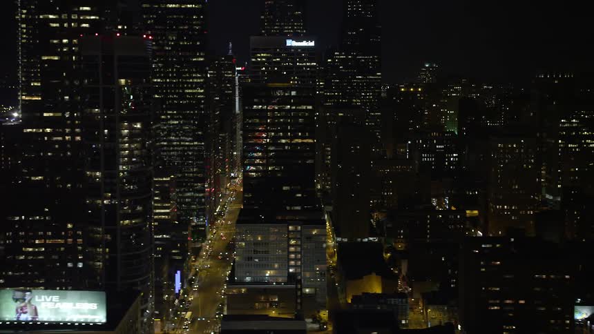 A birds eye view of Downtown Philadelphia skyscrapers and streets at night