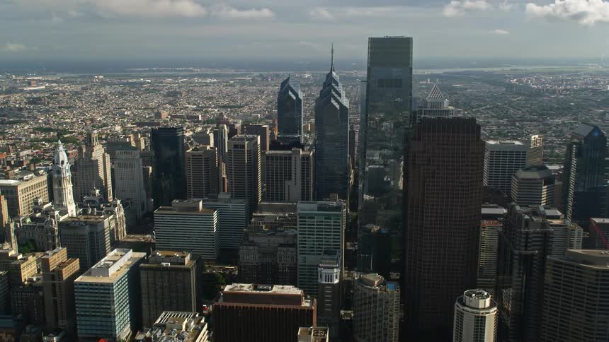 Aerial footage of Philadelphias towering skyscrapers in downtown during the day