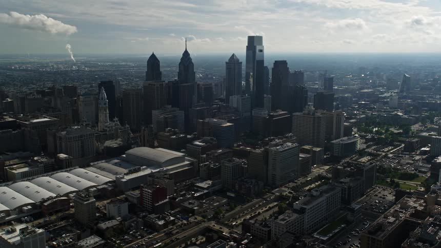 A stunning aerial view of the Pennsylvania Convention Center and skyscrapers in downtown Philadelphia PA on a hazy day with a side view of the city