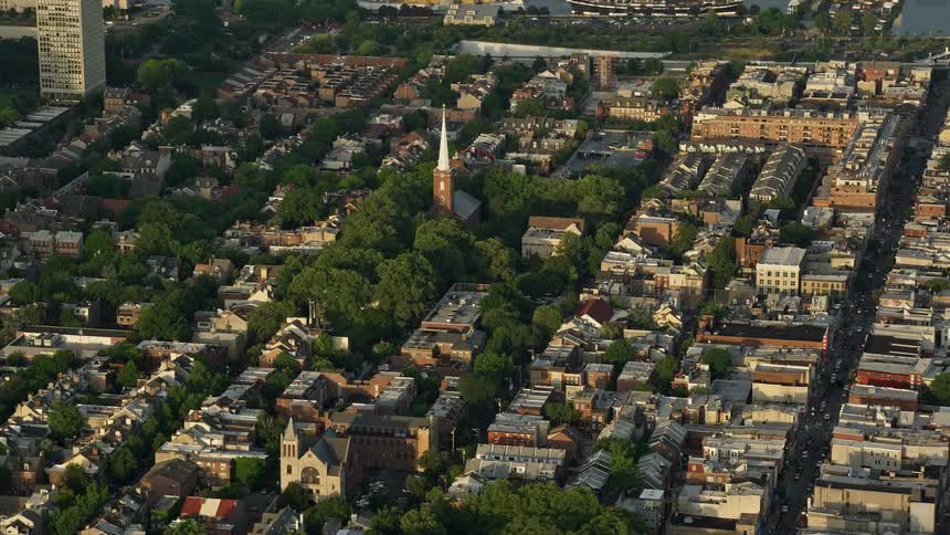 An aerial video of St Peters Episcopal Church in a Philadelphia neighborhood during sunset