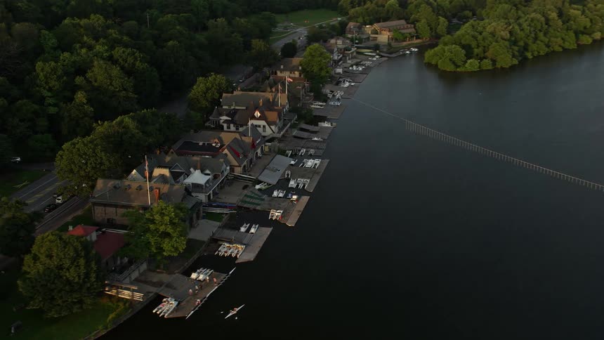 Enjoy a breathtaking aerial view of the Downtown Philadelphia skyline situated next to the ocean and viewed from Boathouse Row and the Schuylkill River at dusk or sunset