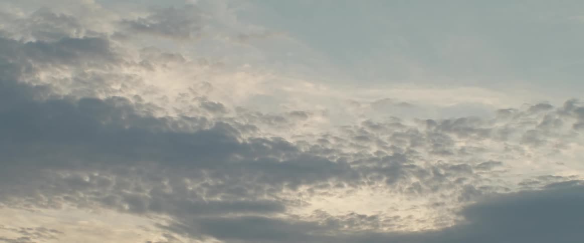 Sunlight reflects on the clouds in a cloudy sky