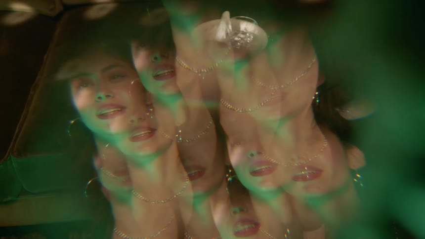 A womans face distorted and mulitplied