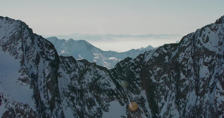 A vast mountain range is covered in snow
