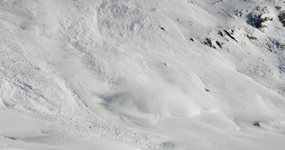 The avalanche tumbles down the mountain