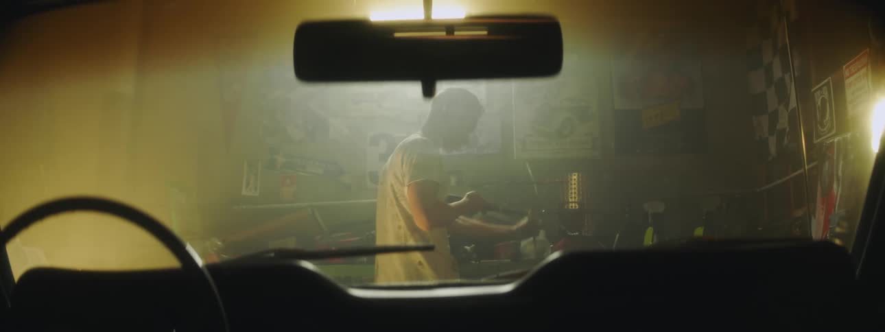 A mechanic is adjusting his tool