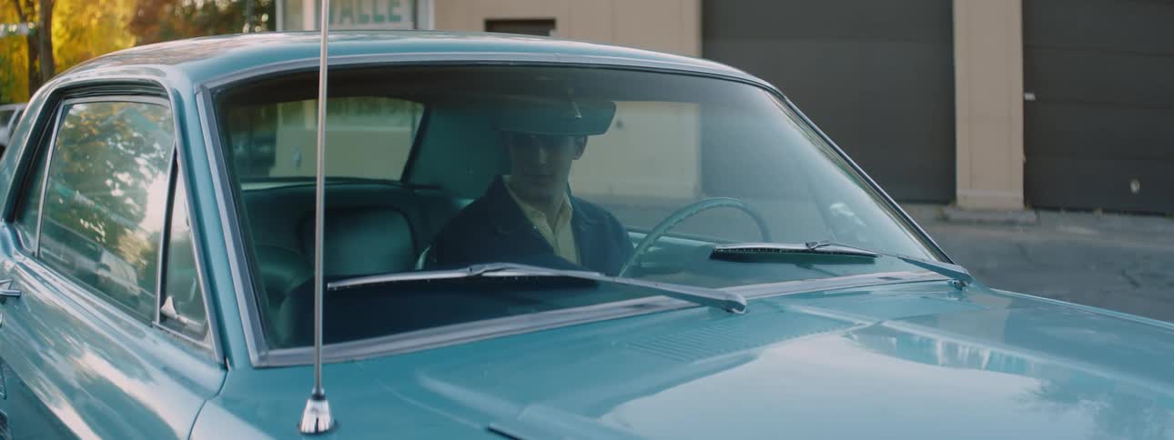 A man gets into the car