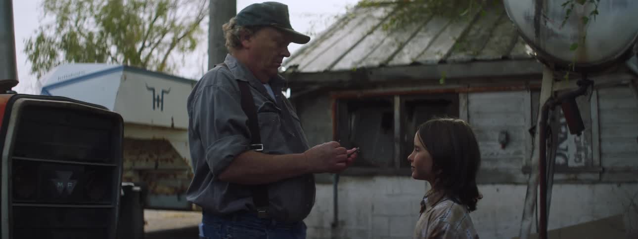 A girl and a man talking while the man hands money to the girl