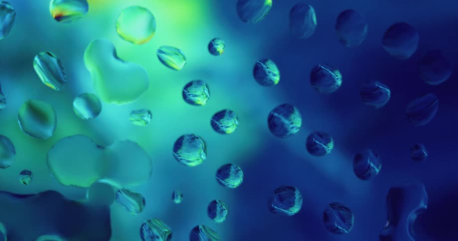 Water droplets on glass reflecting colors and lights