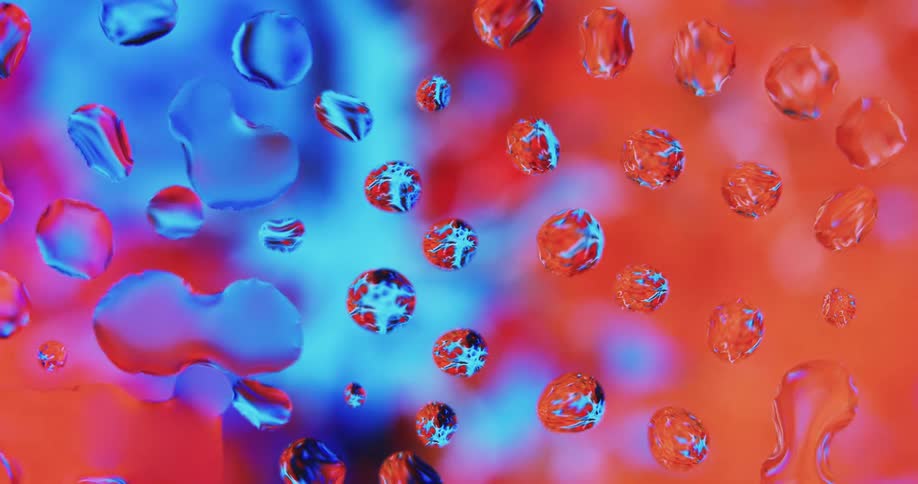 An up close of water droplets and colors in the background