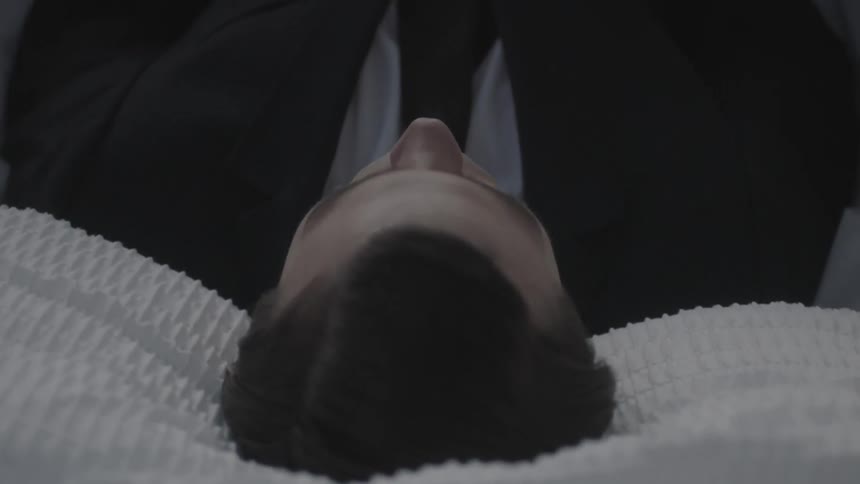 A dead man in a coffin