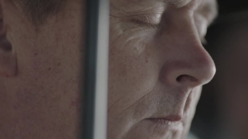 Close up of a man with his eyes closed