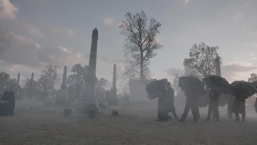 People are walking in a cemetery