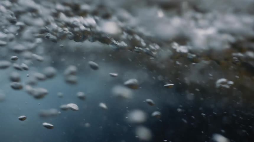 Bubbling Water Rush: Captivating Movement and Floating Bubbles