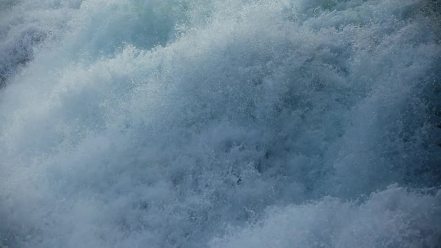 Majestic Cascade: White Water Flowing over Waterfall under Overcast Sky