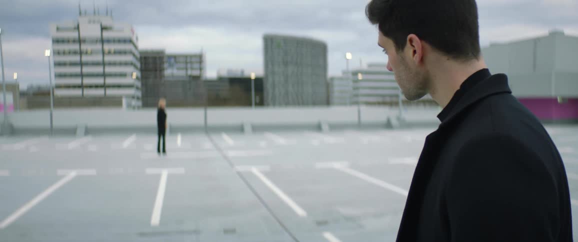 A camera pan upwards to mans face