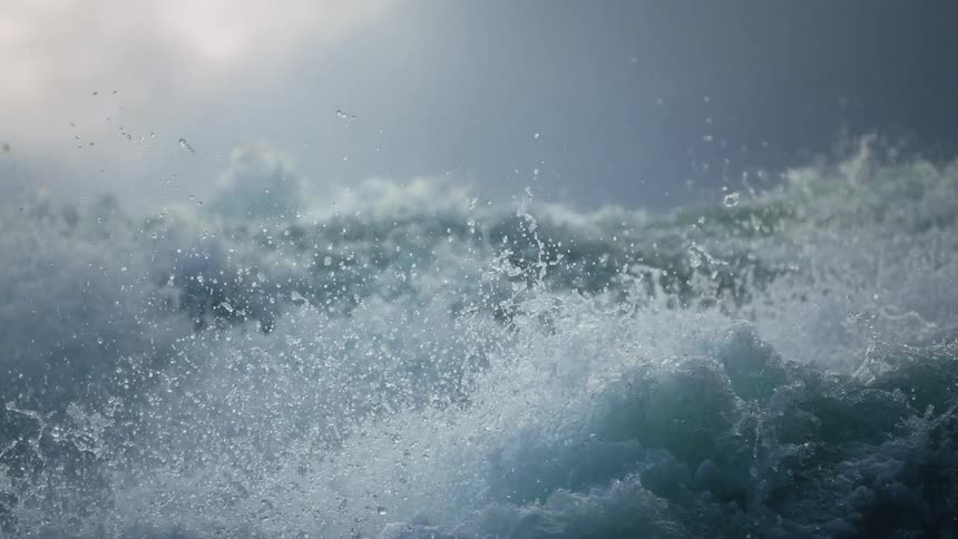 Dynamic Water Symphony: Rapid Movement, Splashes, Foams, and Sunlit Cloudy Sky