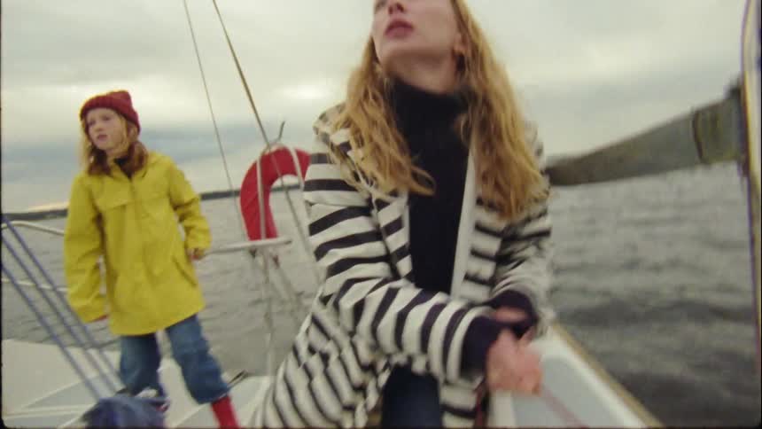 Mother and daughter are on a boat together