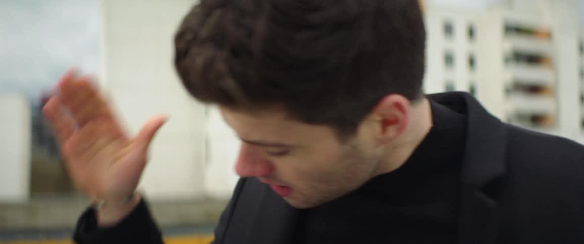 An up close of a mans face expressing frustration