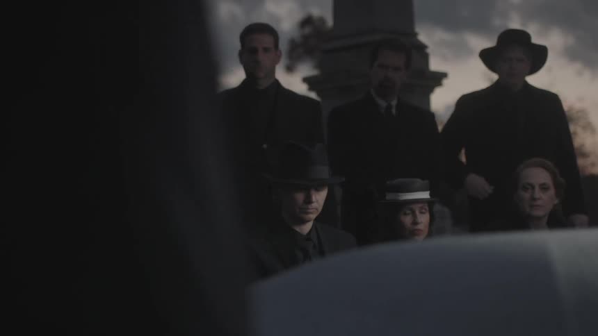 People are attending a funeral service