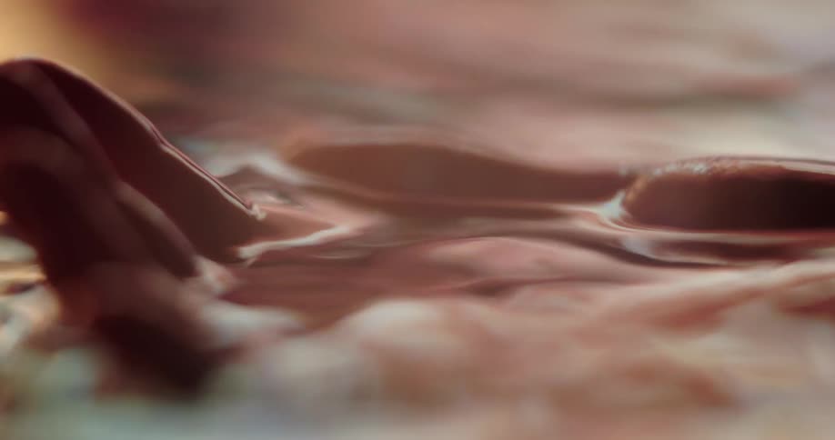 A person dipping their hand in and out