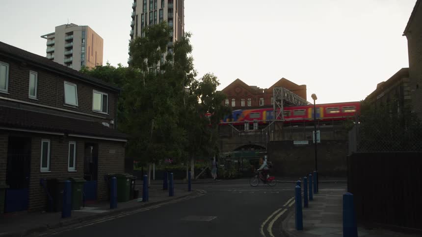 London train passes at dusk