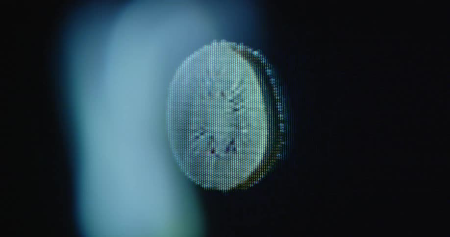 Pixelated fresh kiwi slice spins around with black background on old television screen with transformation