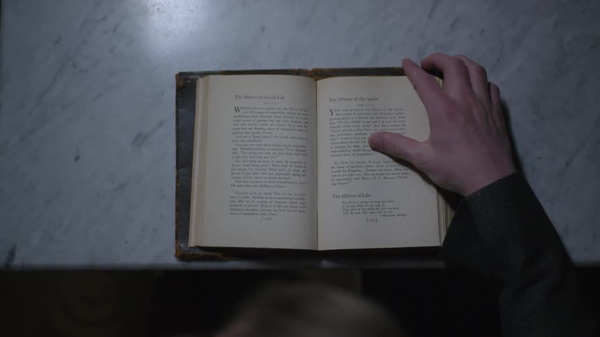 Man flips through a book