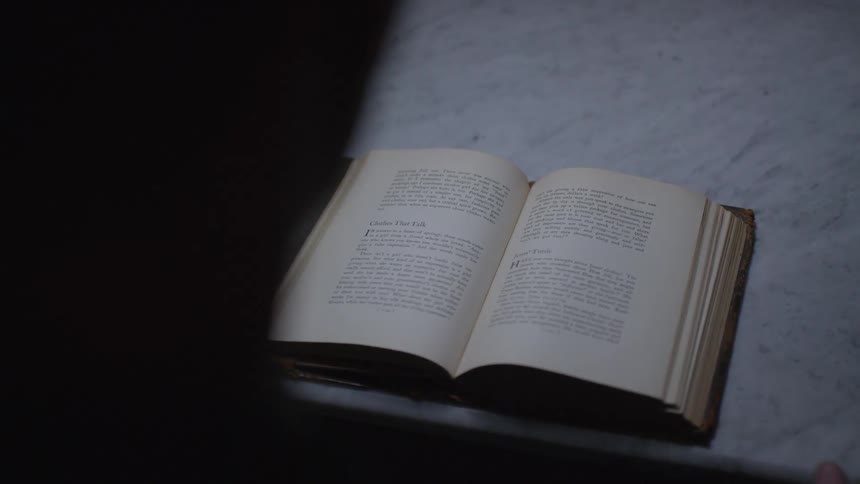 A man flips through a book