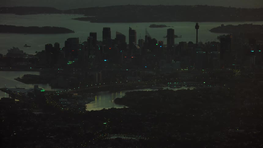 A silhouette of a city skyline at night