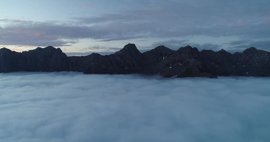 Aerial view of clouds covering the mountains are displayed