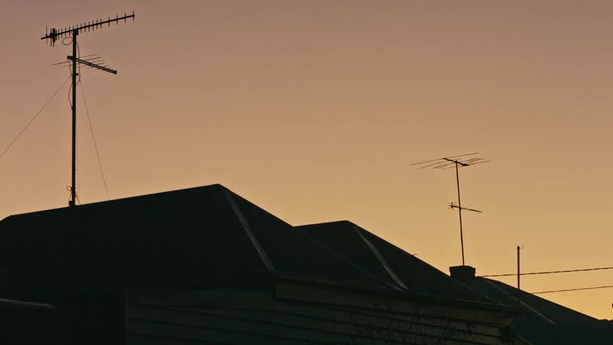 Sunset over residential rooftops