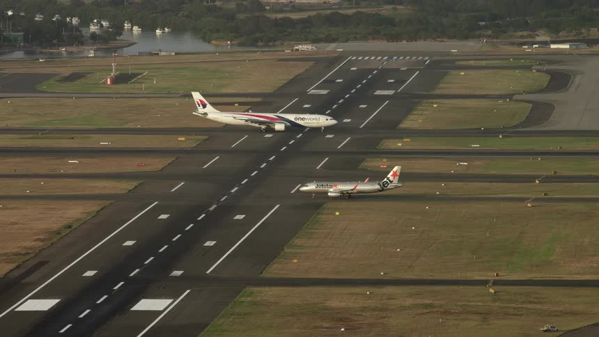 The planes roll across the runway