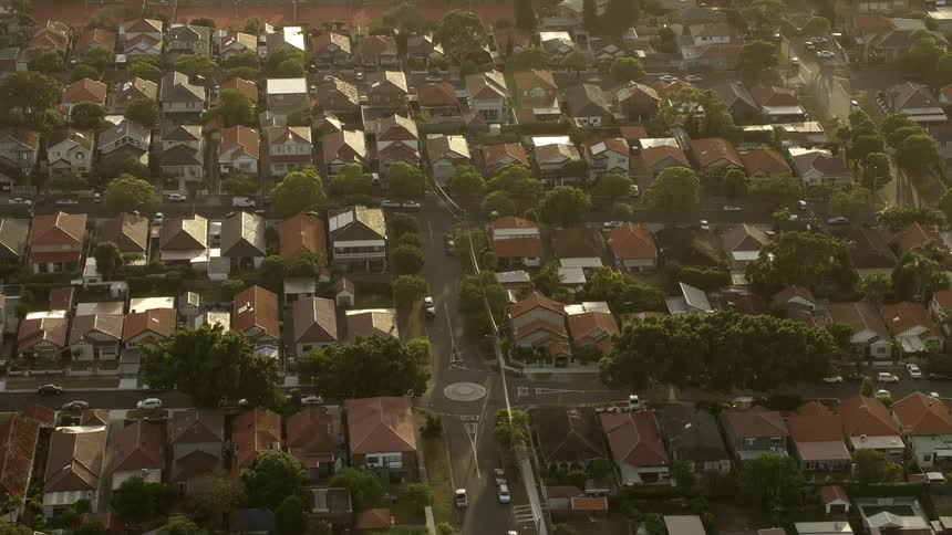 Aerial view of a suburban city is displayed in spring