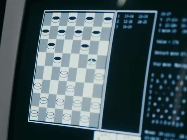 Close up of the screen of a computer displaying a checkers board game