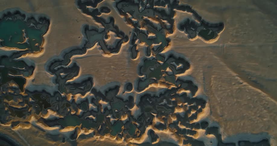 Water fills some canyons in area of badlands