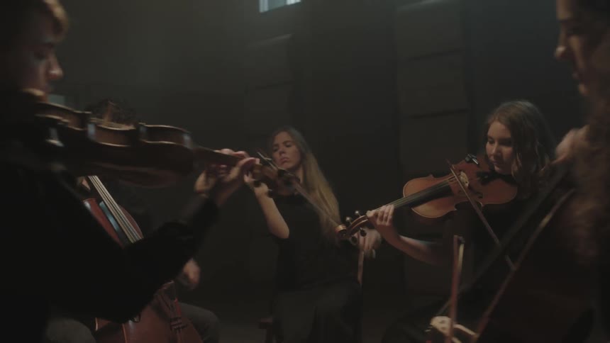 People are playing instruments in a circle