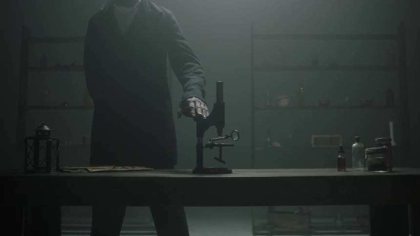 A man walks past and touches a microscope