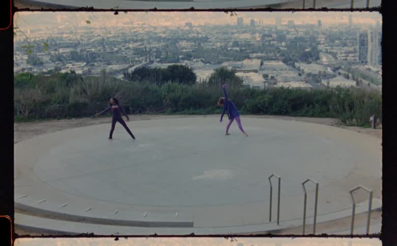 Two women are dancing in the circle