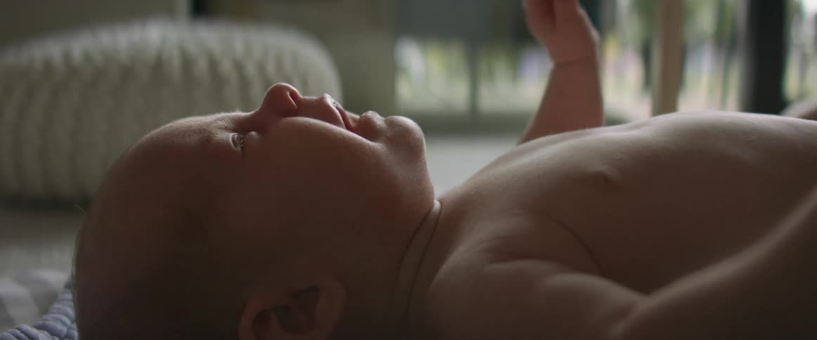 A baby is crying and moving around