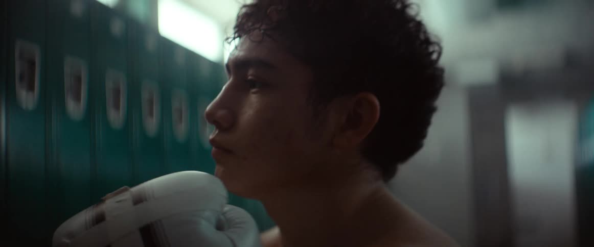 Boxer steps from foot to foot while waiting in locker room